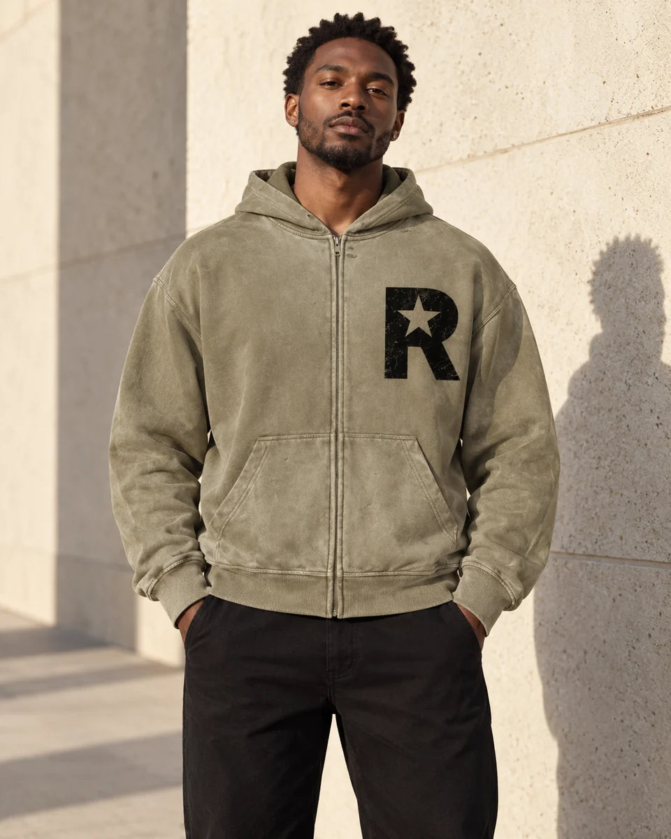 Shop the men’s edit: model wearing the olive Reallyfe zip hoodie