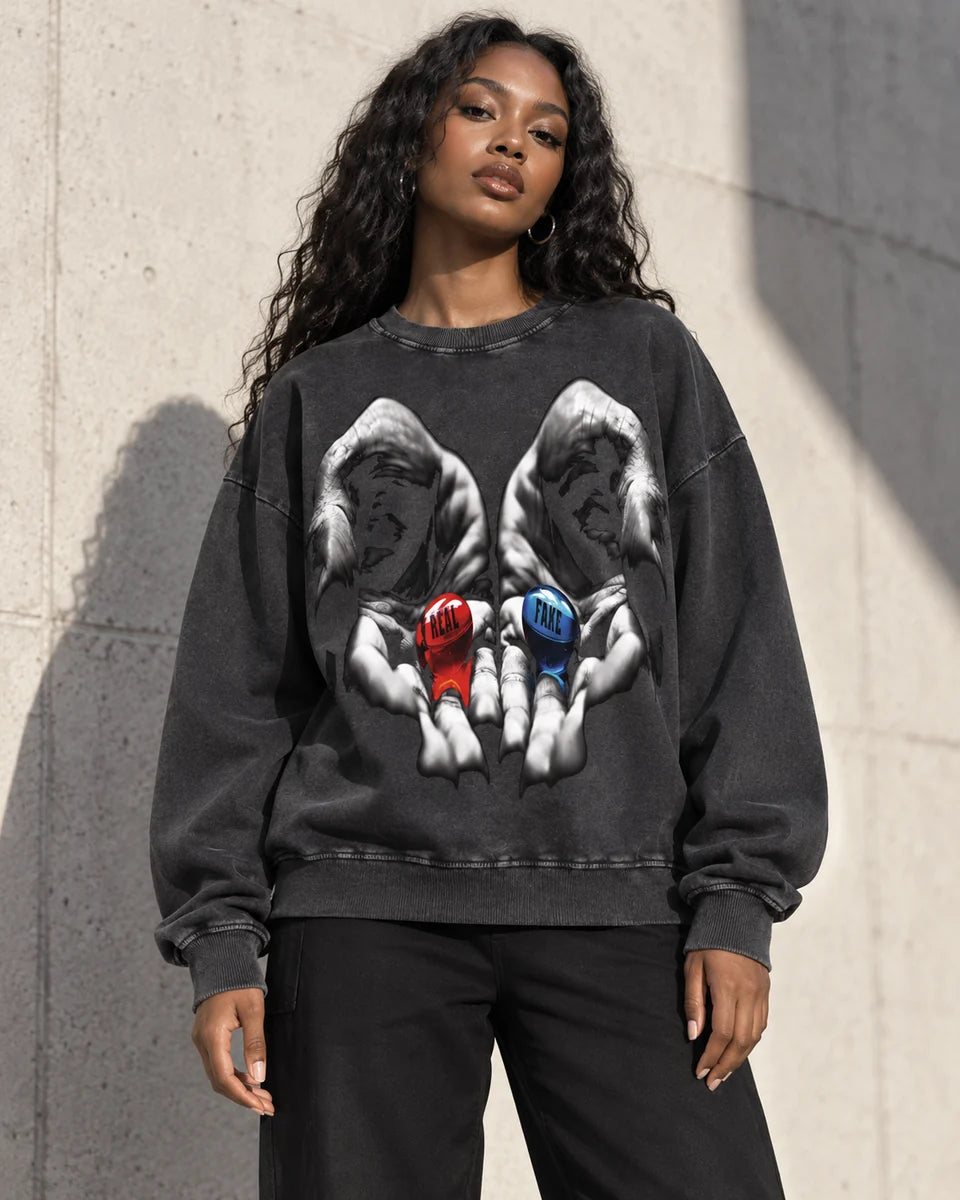 Shop the women’s edit: model wearing the black Real vs Fake sweatshirt